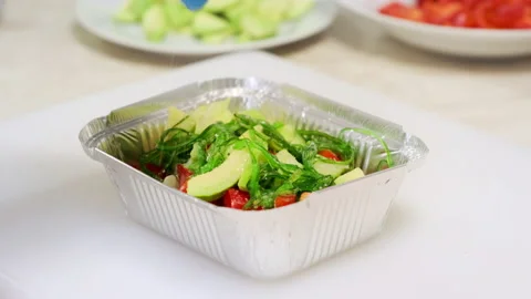 Chef hands salt vegetable salad with avocado Stock Footage 208391958