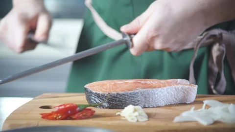 Chef hands sharpening knife before to cook food at kitchen restaurant. 스톡 동영상 124709141