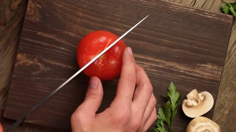The chef hands slicing vegetables by knife slowmo Stock-Footage 81688602