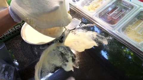 Chef Hands Stretching Fresh Pizza Dough on Floured Surface in Professional Kitch Stock Footage 337676851