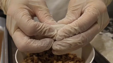 Chef Hands Stuffing Mochi Dough with Chopped Peanut Filling 스톡 동영상 345291755