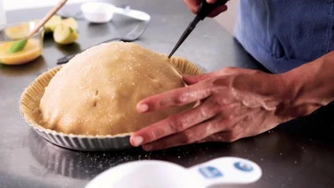 Chef hands trimming pie crust with scissors – Holiday preparation, Thanksgiving Stock Footage 321564217