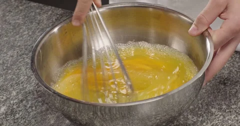 Chef hands whisking eggs to prepare dough, pancakes, scrambled eggs, omelet Stock Footage 262900953