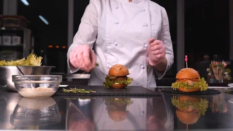 The chef has finished cooking the burger, 4K Stock Footage 124164879