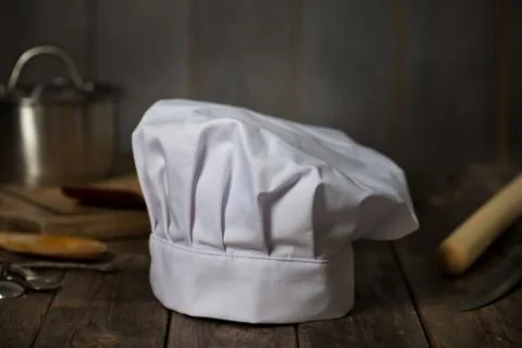 Chef hat with kitchen settings and rustic look Stock Photos