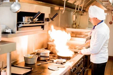 Chef with high burning flames Stock-Fotos
