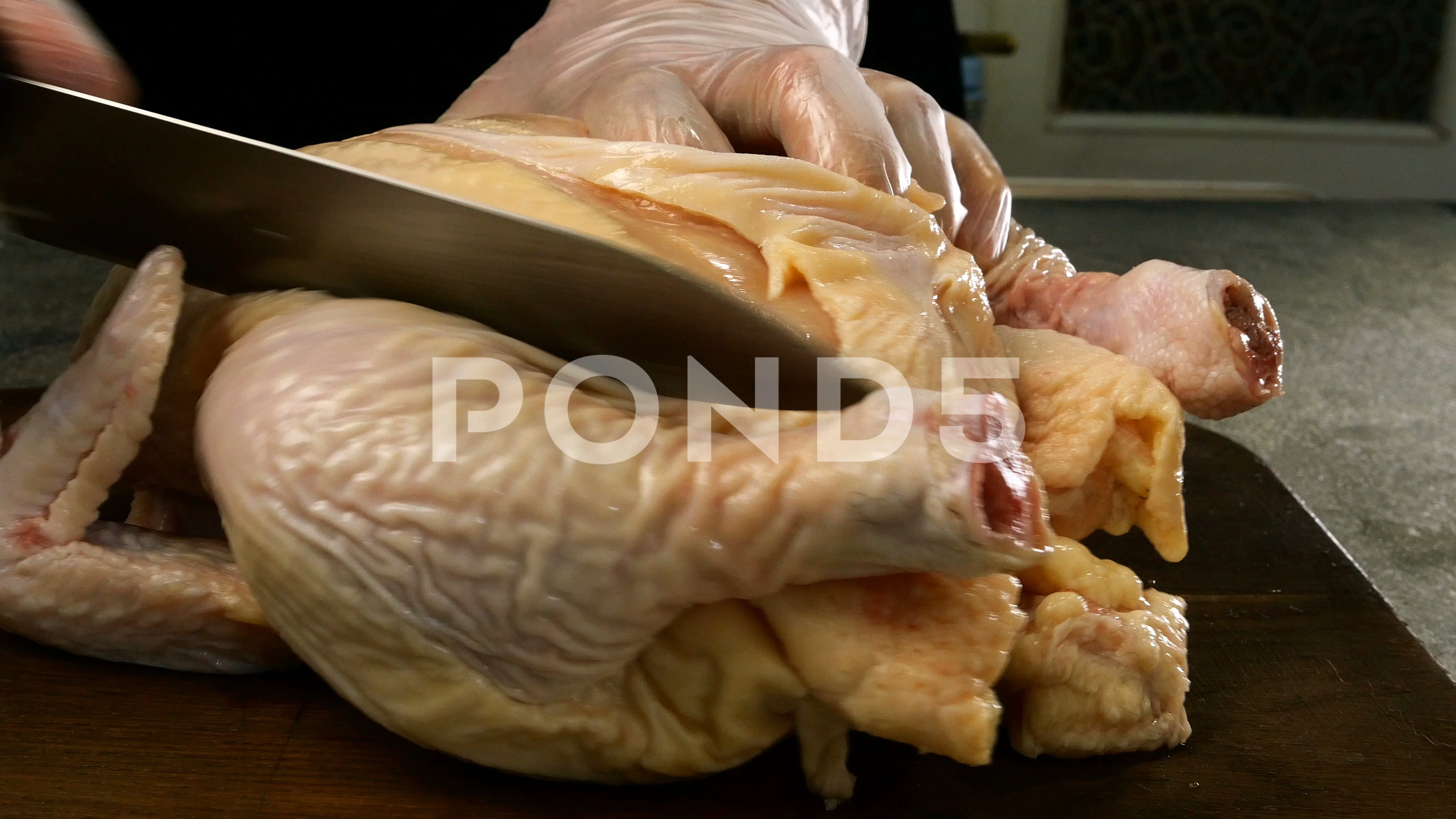 Female Hands Chef Cutting Raw Chicken Meat Breast. Stock Footage