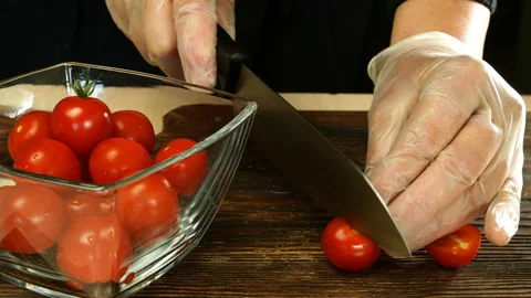 Chef with his hands takes cherry tomatoes. Stock Footage 133157133