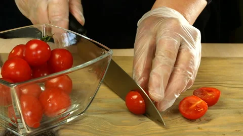 Chef with his hands takes cherry tomatoes. Stock Footage 133157426