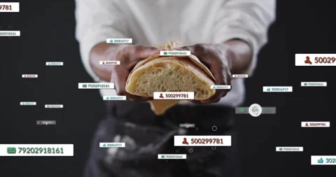 Chef holding half loaf of bread, fading numeric badge initiating data overlays Stock Footage 310282974