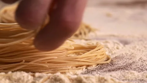 Chef holding in hands raw pasta. Preparing homemade food of Italian cuisine. Vídeos de archivo 149078557