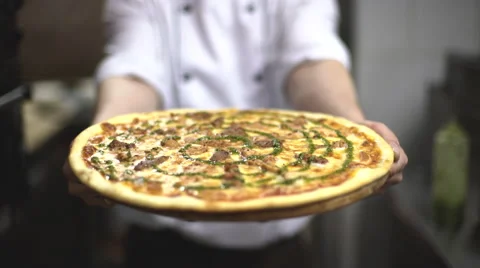 Chef holding pizza Stock Footage 61896386