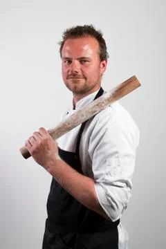 Chef holding rolling pin Stock Photos
