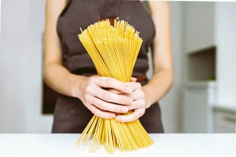 Chef holding spaghetti Stock Photos