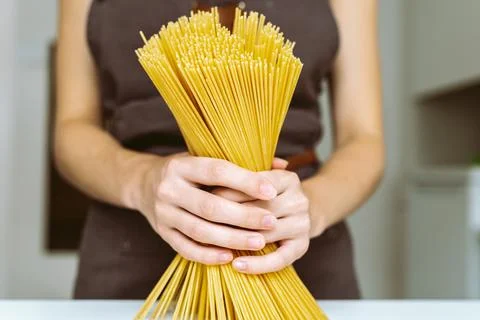 Chef holding spaghetti Stock Photos