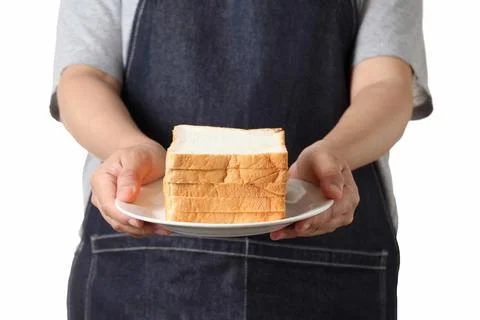 Chef holding toast wheat bread sliced on white background Stock Photos