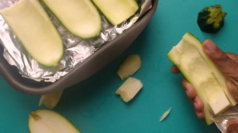 Chef home cooking delicious courgette recipe in kitchen at home - 15 s Stock Footage 134976341