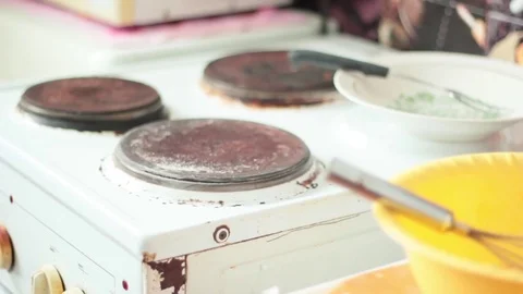 Chef at home putting the pan on the stove Stock Footage 73561663