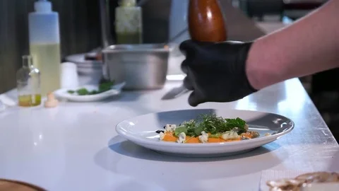 Chef in hotel or restaurant kitchen cooking Stock Footage