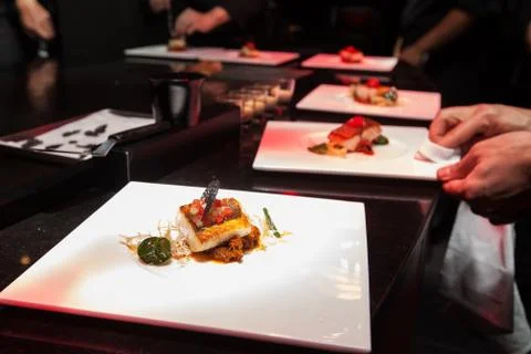 Chef in hotel or restaurant kitchen cooking for dinner Stock Photos
