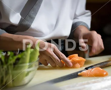 Chef Japanese cuisine in hotel or restaurant kitchen cooking, only hands. H.. Stock Photos