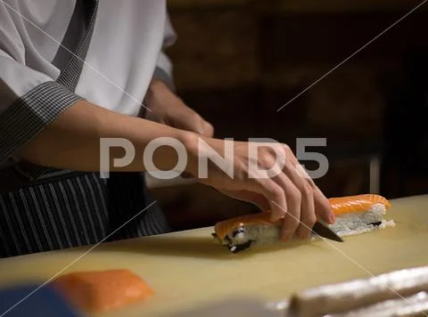 Chef Japanese cuisine in hotel or restaurant kitchen cooking, only hands. H.. Stock-Fotos