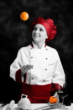 Chef juggling with orange Stock Photos