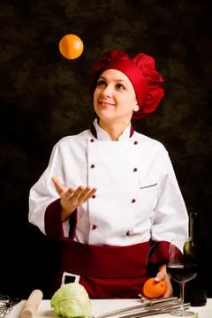 Chef juggling with orange Stock Photos