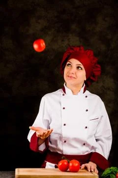 Chef juggling with tomato Stock Photos