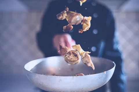Chef jumps in pan Stock Photos