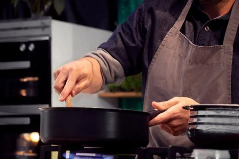 Chef kitchen cooking and prepping ingredients in restaurant Фото