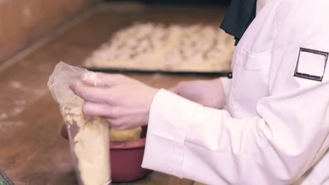 Chef on a kitchen decorating pie Stock Footage 75059521