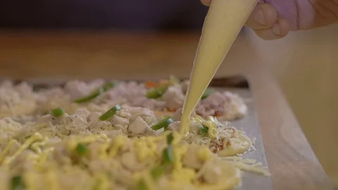 Chef on a kitchen decorating pie Stock Footage 75059657