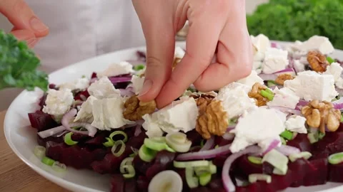 The chef in the kitchen prepares a healthy salad of beets Stock Footage 265177228