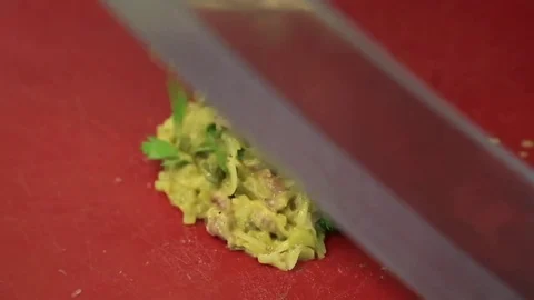 The chef in the kitchen preparing carpaccio  Stock Footage 83587400