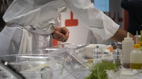 Chef in the kitchen preparing a dish Stock Footage 56709449