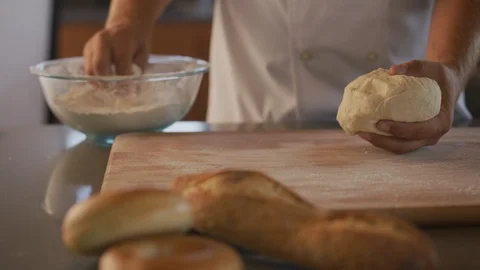 Chef kneading bread dough at bakery Stock Footage 101273416
