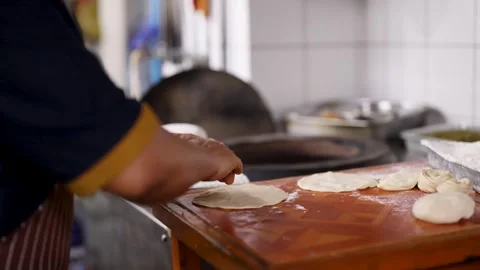 Chef Kneading Dough and Shaping Flatbread in Commercial Indian Kitchen Stock Footage 345710561