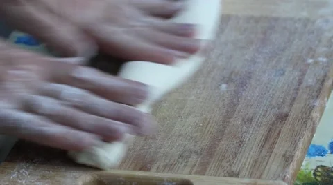 Chef kneading dough on cutting board Stock Footage 62959897