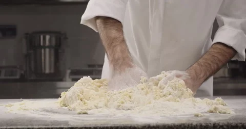 Chef kneading dough with hands. Traditional Italian pasta recipe. Dough Stock Footage 269787770