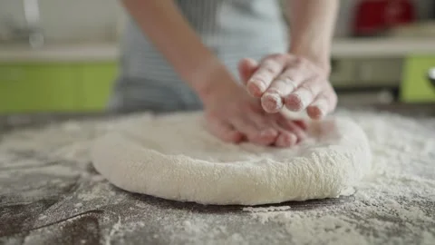 Chef is kneading dough with her hands in the kitchen for making pizza Stock Footage 280167915