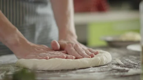 Chef is kneading dough with her hands in the kitchen for making pizza Stock Footage 280168705
