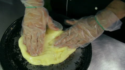 Chef kneading the dough in the pan 스톡 동영상 41919318