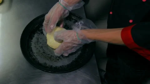 Chef kneading the dough in the pan Stock Footage 41930062