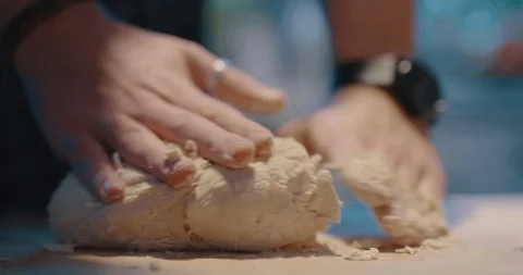 Chef kneading homemade bread dough no table in kitchen Stock Footage 124211052