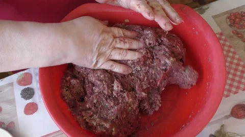 Chef kneading minced meat for cutlets Stock Footage 183412398
