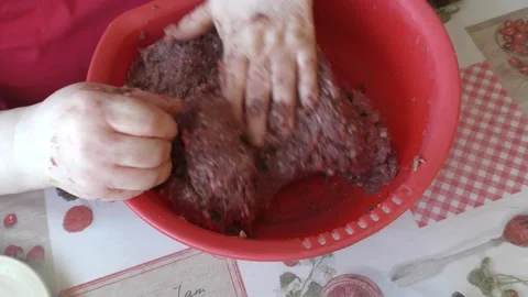 Chef kneading minced meat for cutlets Stock Footage 183412608