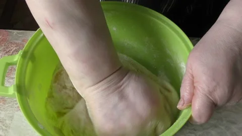 The chef kneads the dough with his hands Stock Footage 166707073
