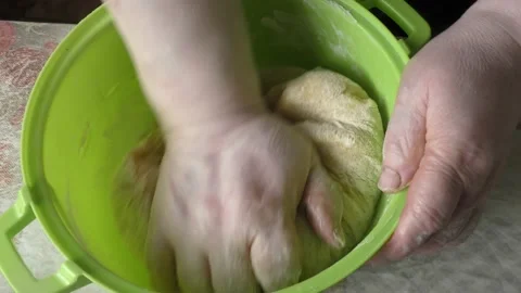 The chef kneads the dough with his hands Stock Footage 166707330