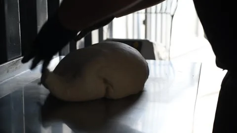 The chef kneads the dough with his hands for making Neapolitan pizza Stock Footage 263073106